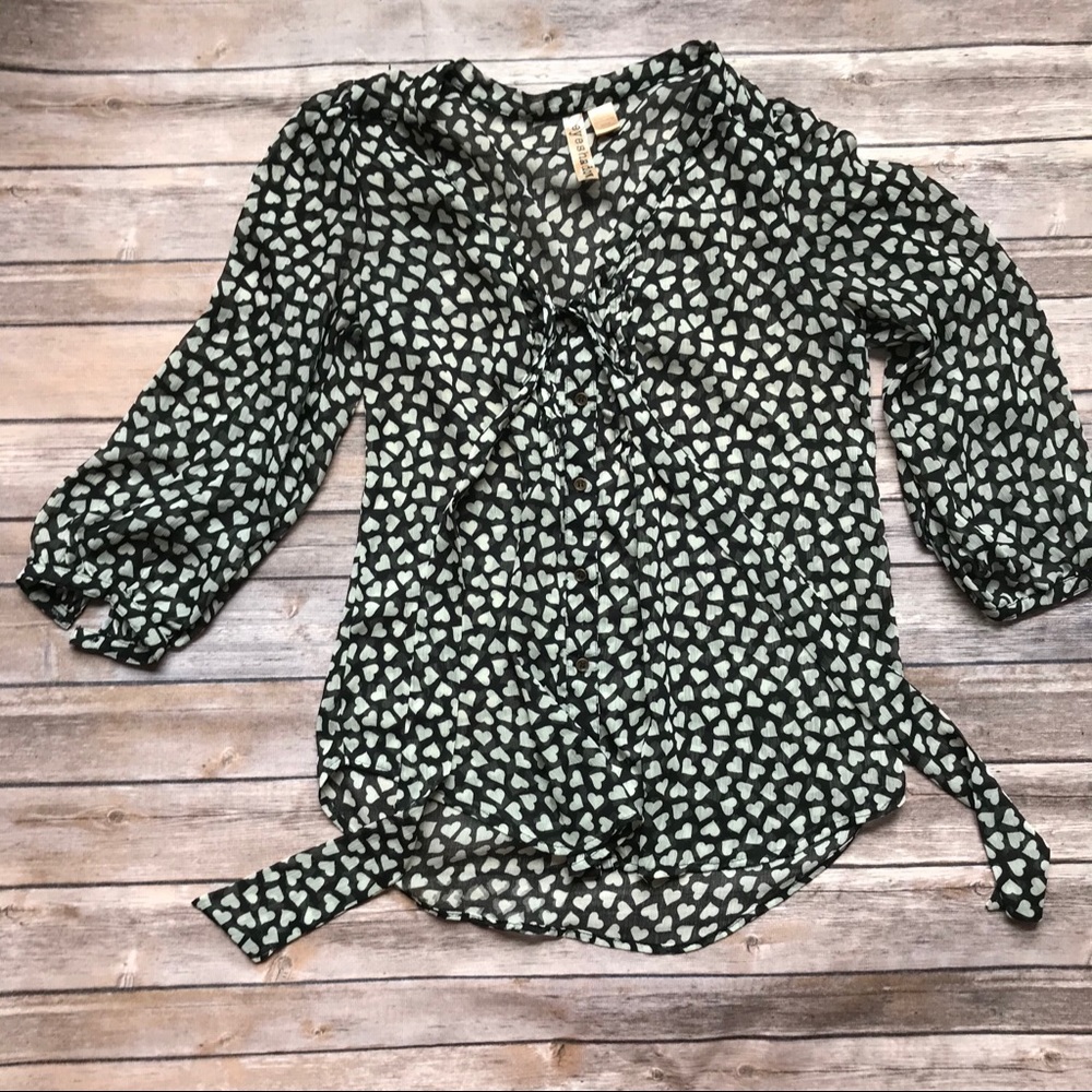 Sheer black blouse with heart detail